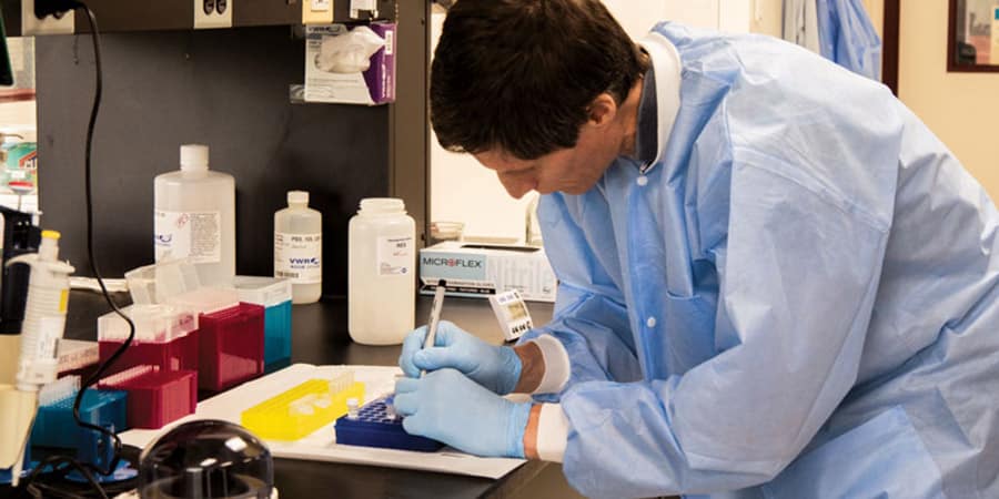 dna-instruction-set-agt A scientist works in the lab